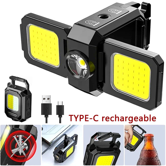 A sleek black multifunctional keychain light featuring dual COB LED panels in a compact, portable design.